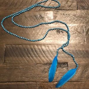Long beaded crystals feathers necklaces by Miami based designer Mare Sole Amore.